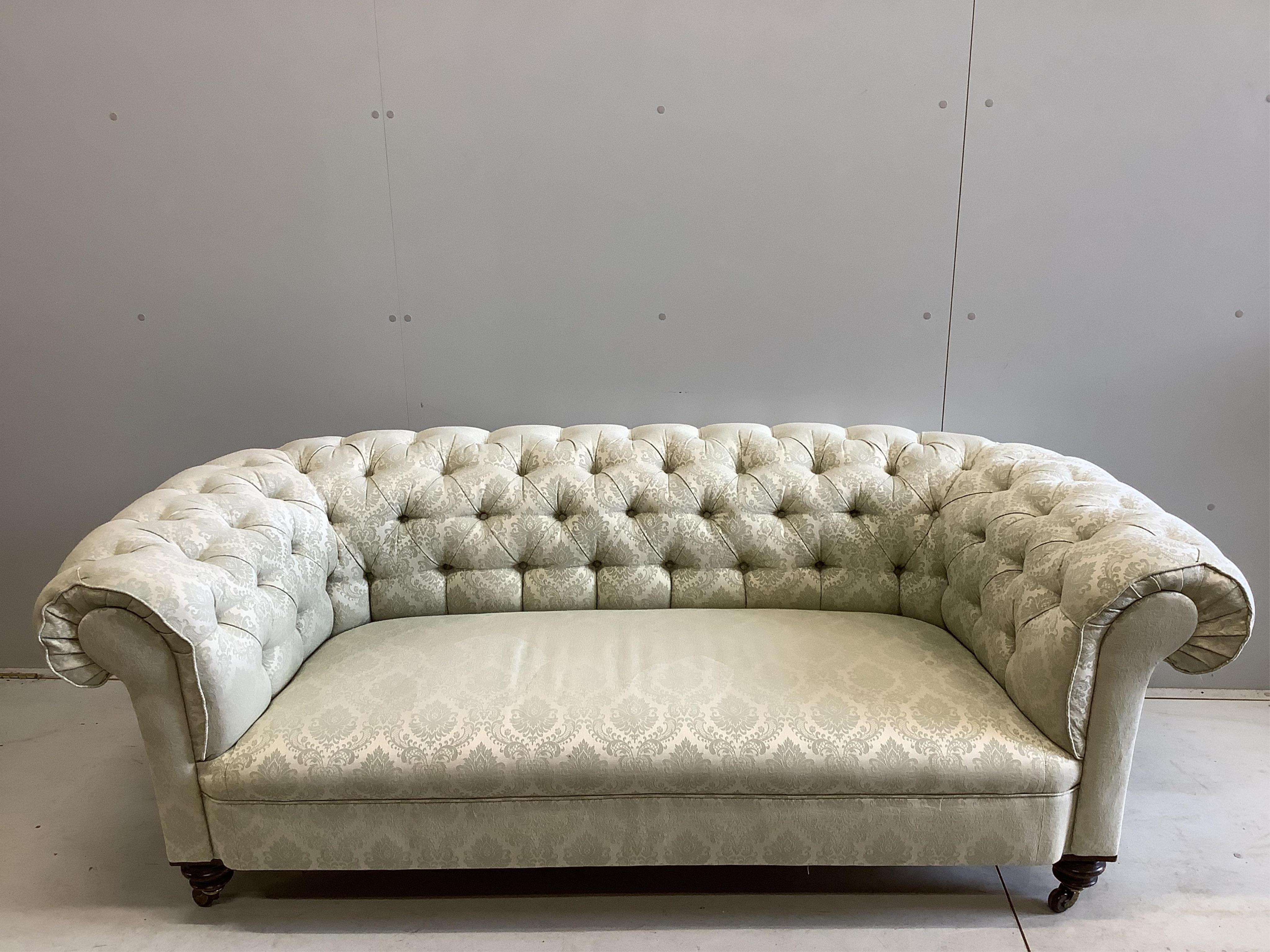 A late Victorian upholstered Chesterfield settee, width 190cm, depth 86cm, height 66cm. Condition - fair